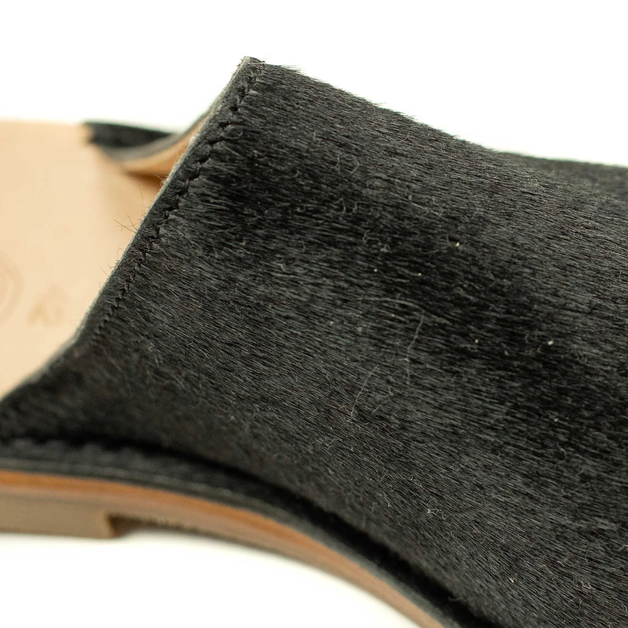 Exclusive mules in black hair-on calf