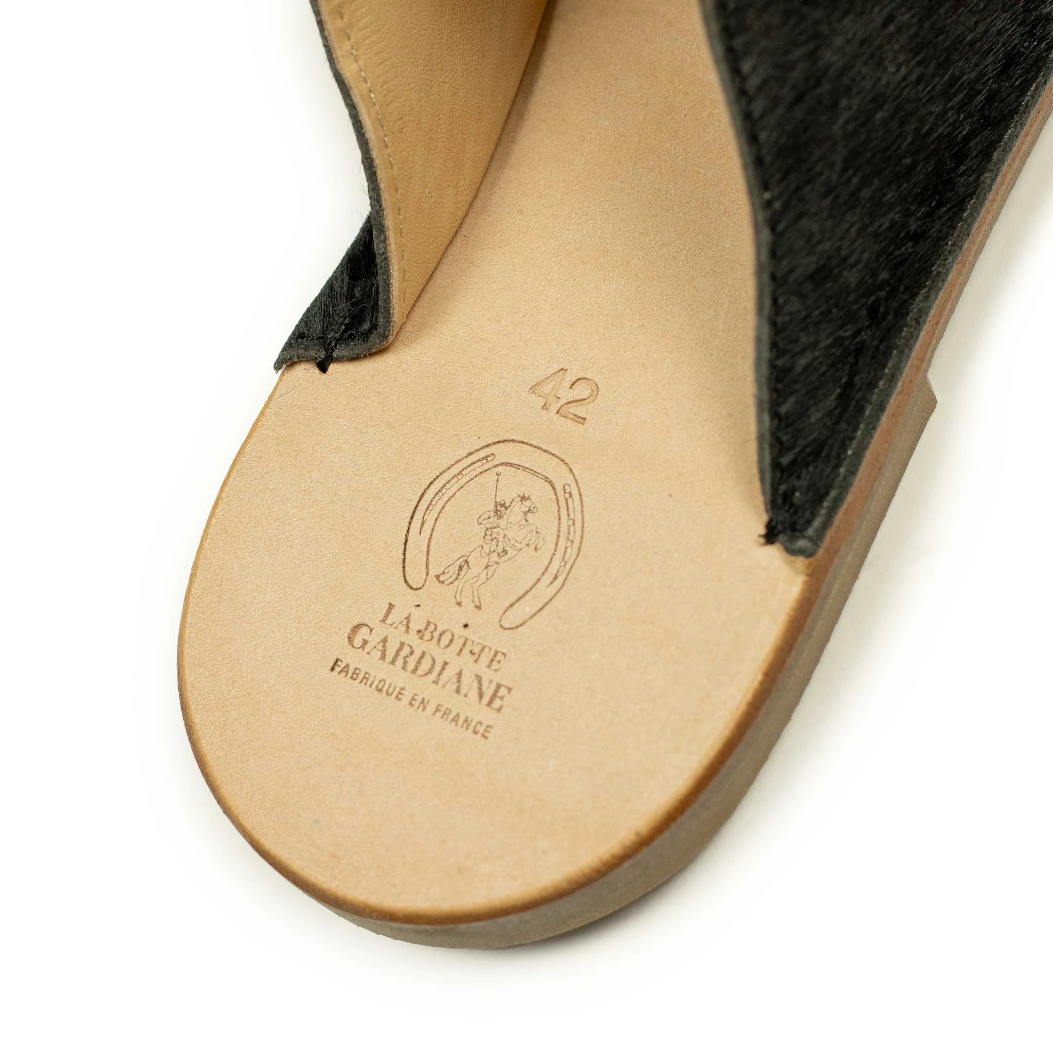 Exclusive mules in black hair-on calf